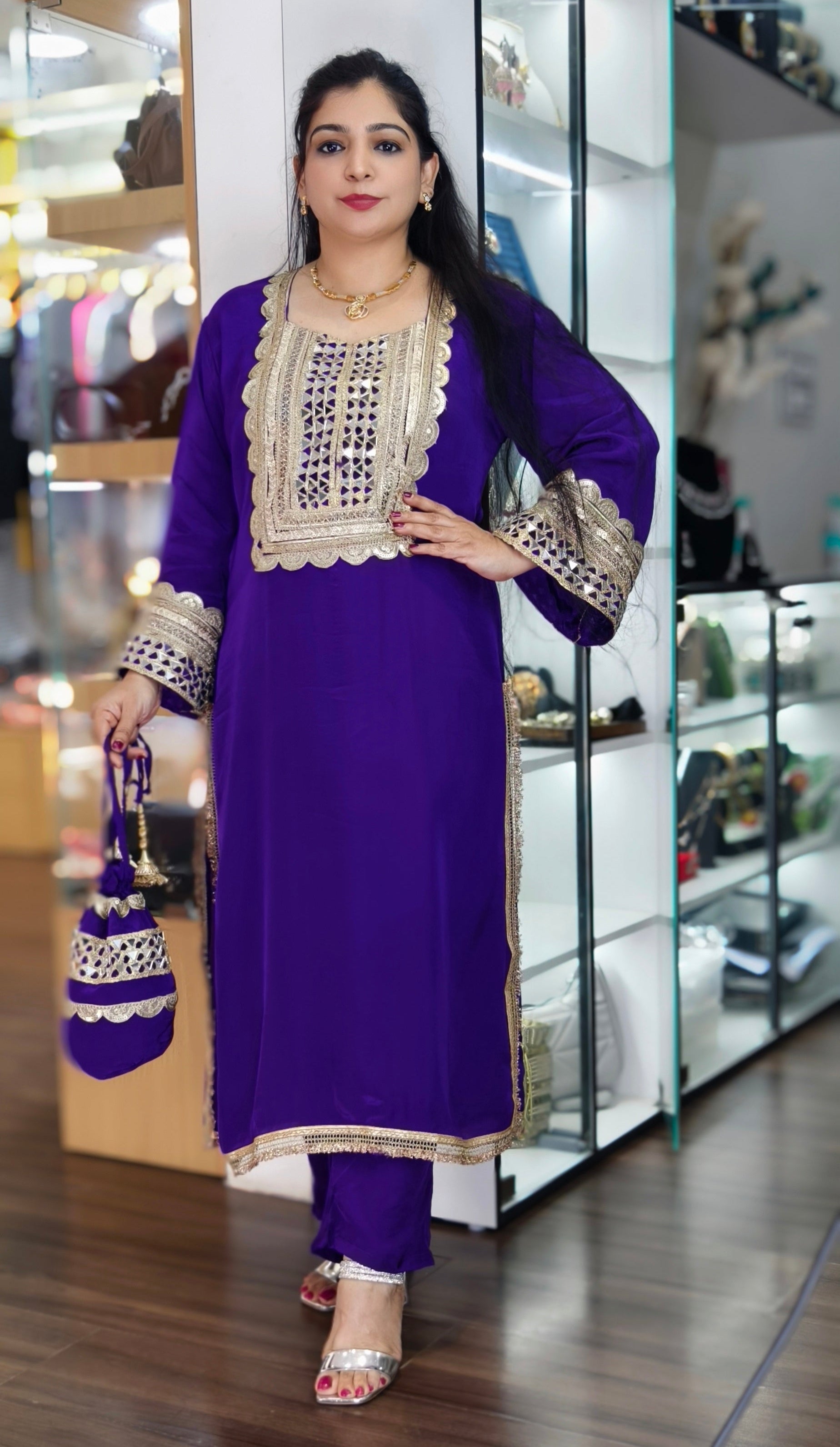 PURE CREPE FASHIONABLE DRESS WITH ELEGANT POTLI BAG