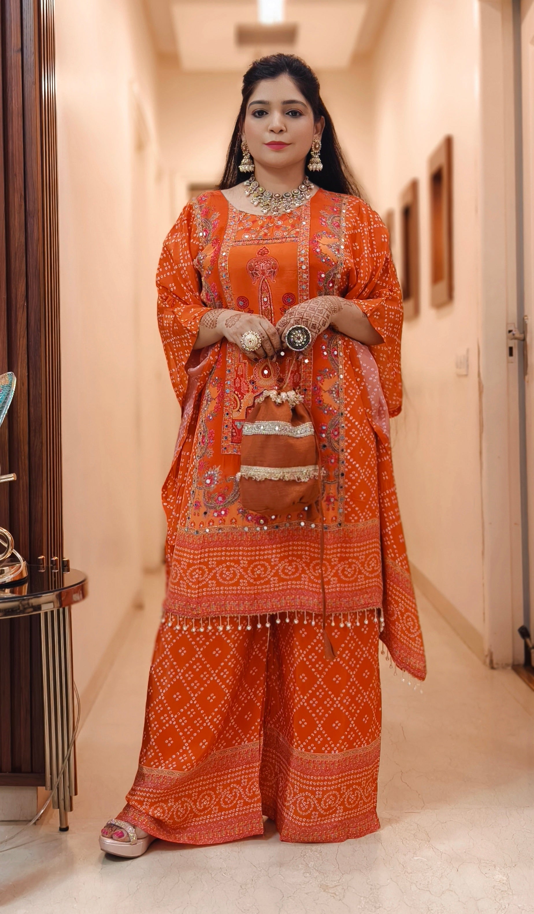 ORANGE AND PINK PREMIUM CREPE DESIGNER PARTY WEAR SHORT KAFTAN WITH FULL HANDWORK AND SARARA WITH POTLI