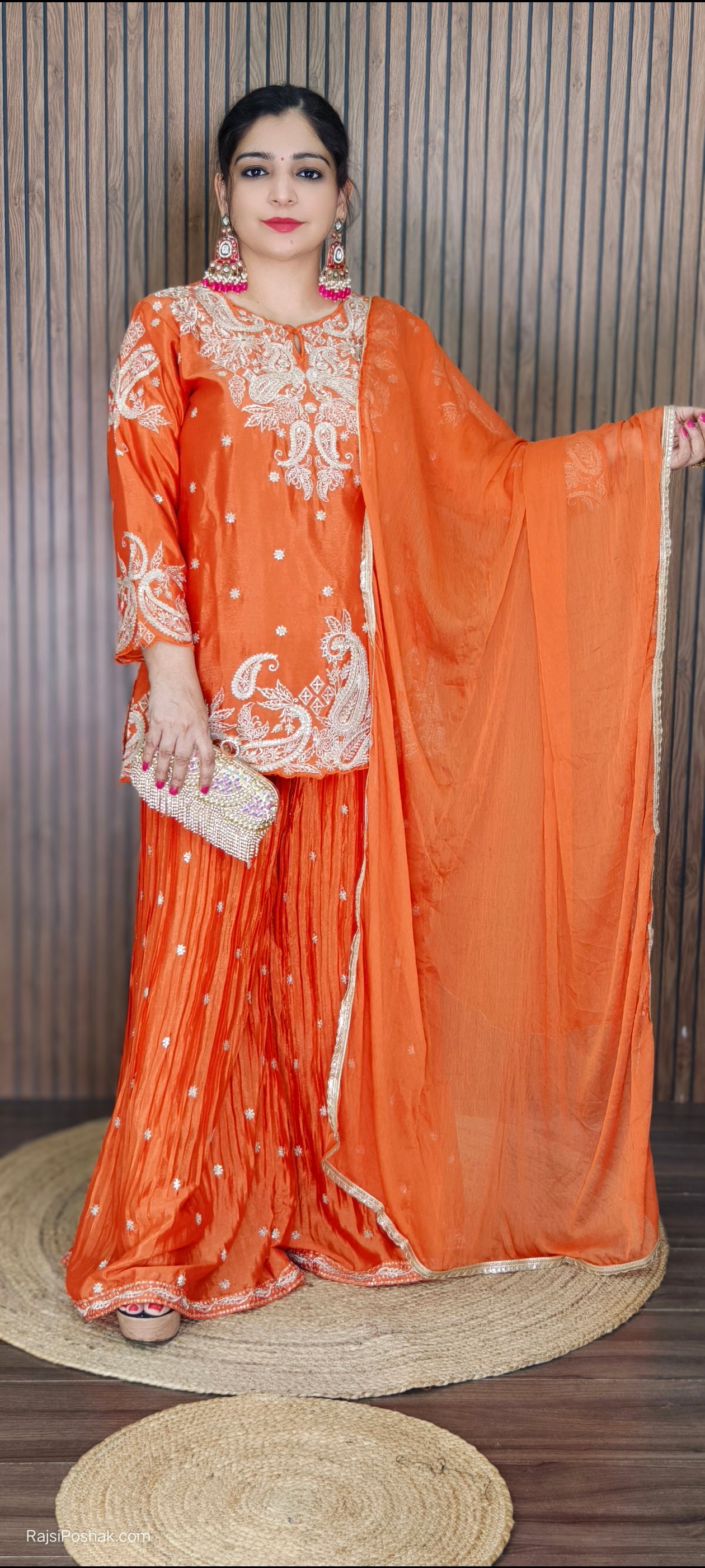 ORANGE,PURPLE & PINK SHARARA SUIT FEATURING INTRICATE ALL-OVER ZARDOZI AND MOTI EMBROIDERY ON THE SHIRT, WITH MATCHING BOOTIES SCATTERED ACROSS THE ENTIRE DUPATTA
