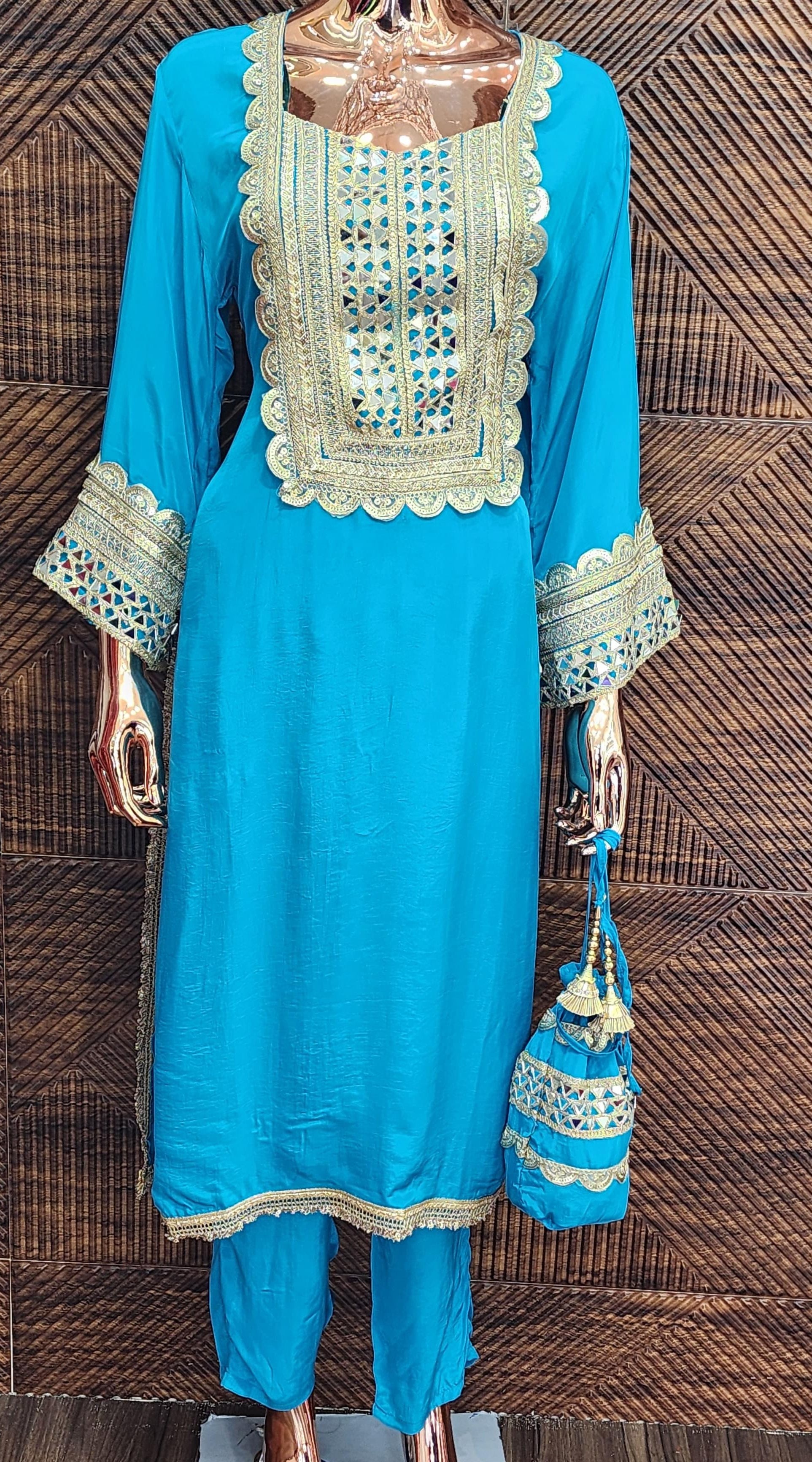 PURE CREPE FASHIONABLE DRESS WITH ELEGANT POTLI BAG